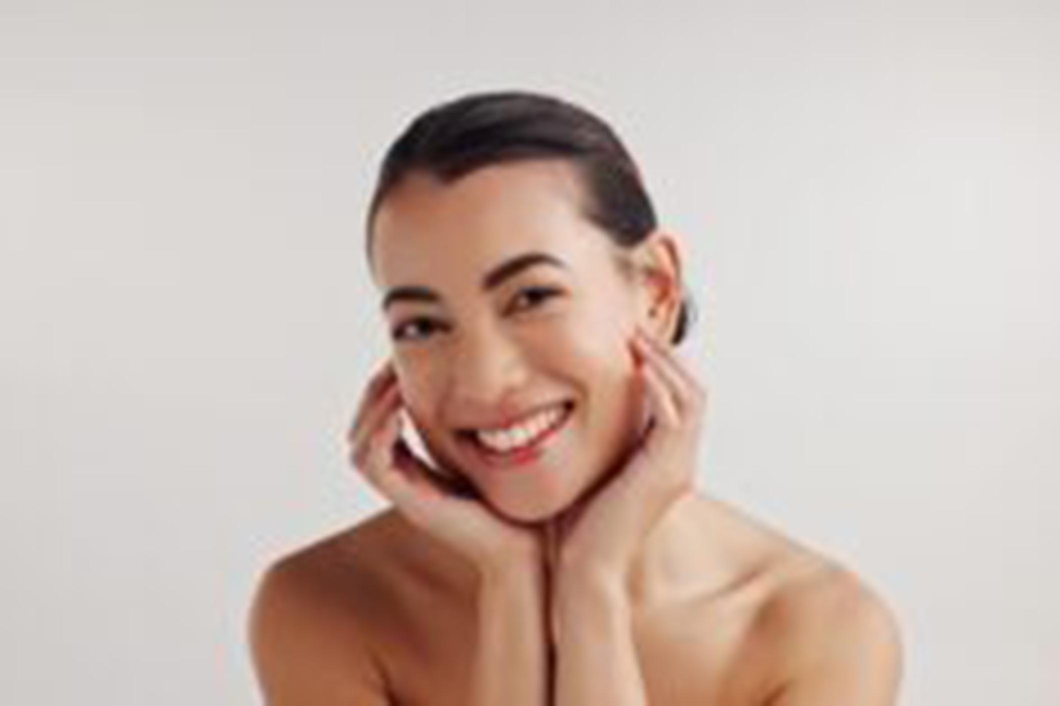 Portrait, smile and woman of skincare in studio with facial treatment, dermatology shine and transformation. Happy, girl and natural beauty, organic cosmetic and aesthetic results on white background